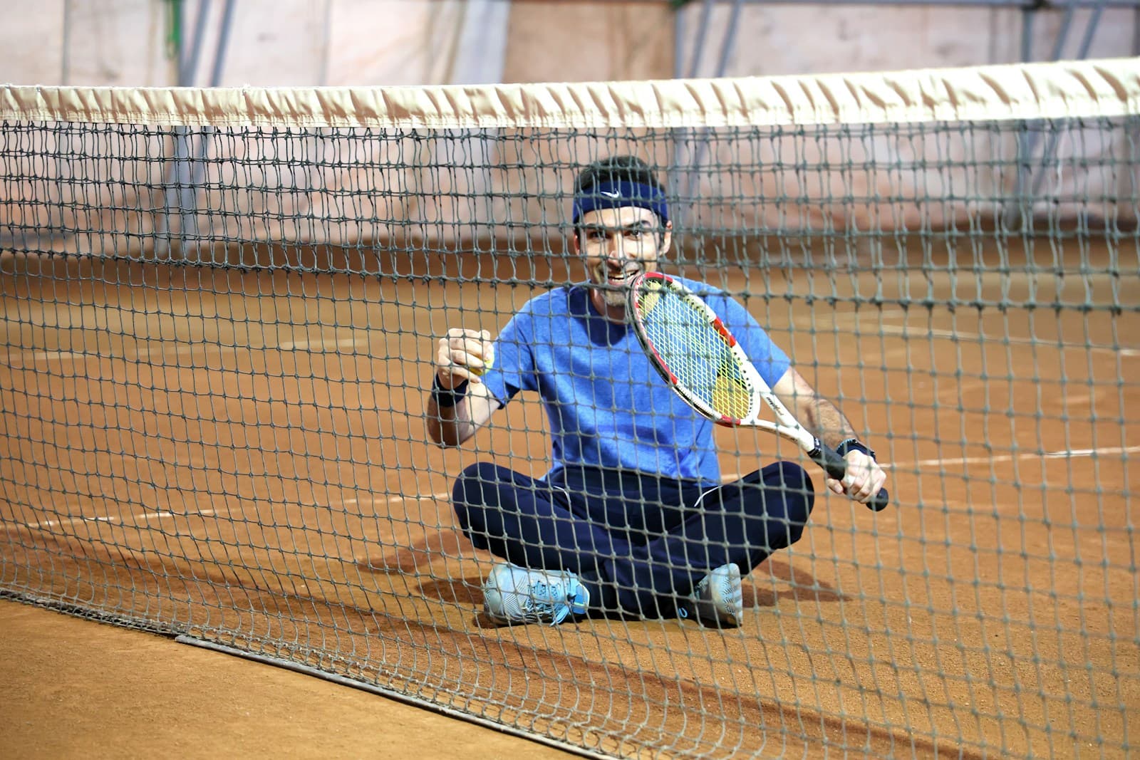 Tennis player celebrating on court